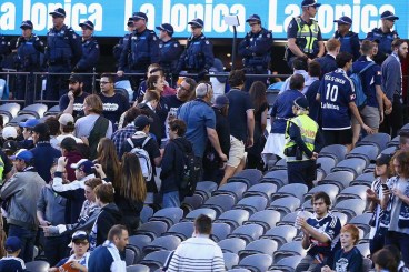 Melbourne Victory fans walk out of their clash with Adelaide. 