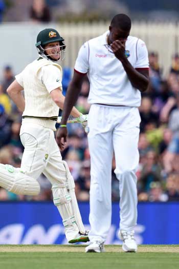 West Indies captain Jason Holder feels the pain as Adam voges cashes in. Photo: Getty