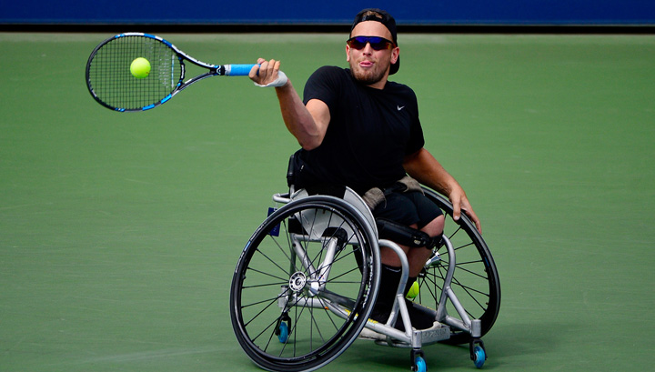 Alcott channels Lleyton Hewitt in a backwards cap during a match in New York this year. Photo: Getty