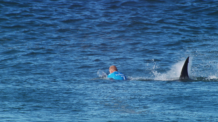 An enduring and horrifying image from 2015 – a shark appracohing Fanning during the J-Bay Open. Photo: Getty