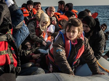 LESBOS ISLAND, GREECE - DECEMBER 25 : Refugees are seen upon their arrival on Mytilene of Lesbos Island, Greece after crossing the Aegean sea from Turkey on December 25, 2015. (Photo by Esteban Martinena/Anadolu Agency/Getty Images)