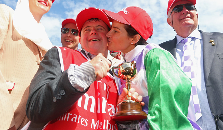 Michelle Payne kisses her brother, strapper Stevie Payne after her historic Melbourne Cup win. Photo: Getty