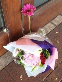Flowers were laid outside the Datta family's Urban India restaurant on Henley Beach Road. Photo: Candice Marcus