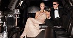 Couple drinking champagne in limo