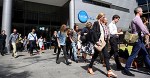 Editorial staff are seen walking out of Fairfax Media headquarters in Sydney, Thursday, March 17, 2016. The company announced today 120 editorial positions would be cut, and in response staff voted to walk off the job until Monday. (AAP Image/Dan Himbrechts) NO ARCHIVING