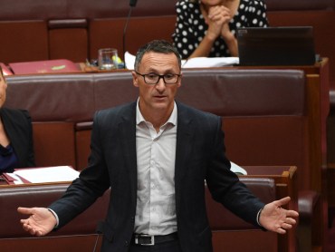 Greens leader Senator Richard Di Natale has condemned the prime minister for capitulating to "homophobic" and "bigoted" members in his party over a same-sex anti-bullying program.
