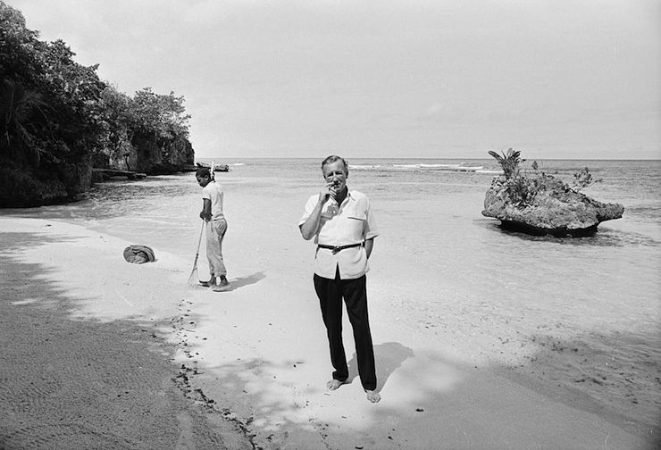Ian Fleming on the beach at Goldeneye in 1964. Photo: Getty