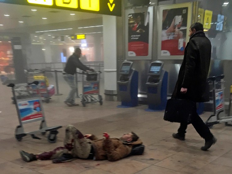 A man lies injured in Zaventern Airport. Photo: AP