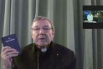 Cardinal Pell swears on the bible before giving evidence at the royal commission. Photo: ABC
