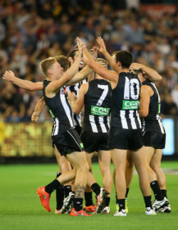 Collingwood celebrate their last-gasp win. Photo: Getty