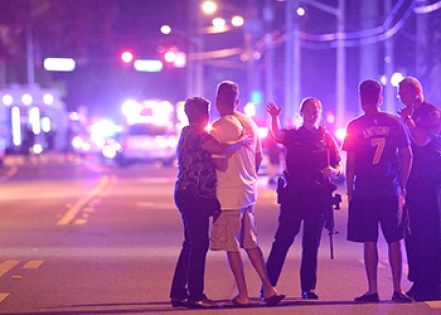 Family members are directed away from the nightclub. Photo: AP