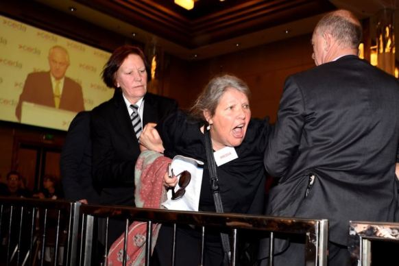 Protester Gaye Demanuele is stopped by security.