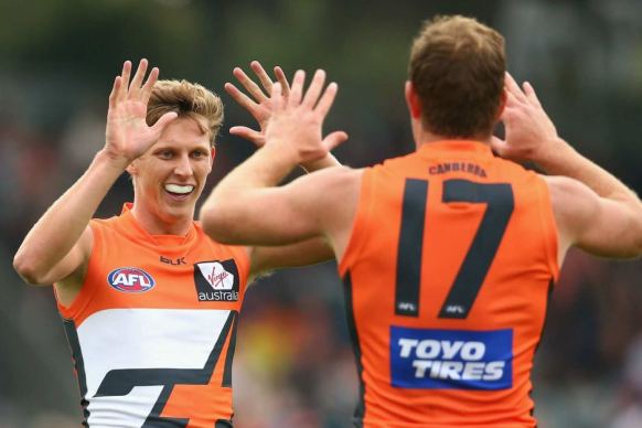Lachie Whitfield (left) is set to line up against the Swans next Saturday.