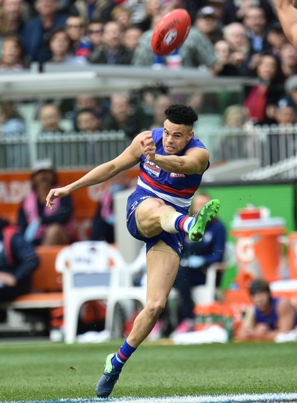 Norm Smith Medallist Jason Johannisen drives the Dogs forward in the final quarter.