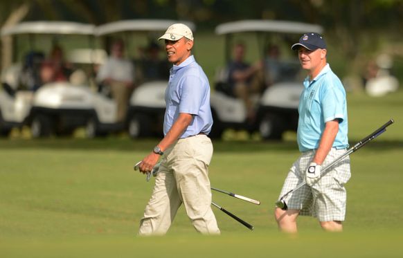 President Barack Obama (L) and John Key playing golf in Hawaii in early 2014. Photo: Getty.