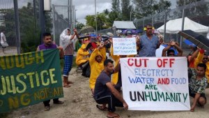 Refugees and asylum seekers at Australia's offshore processing centre at Manus Island are pictured during a peaceful protest on Monday.