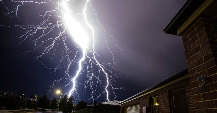 Lightning strikes above a home in Bendigo, VIC. Rikki Pool Photography