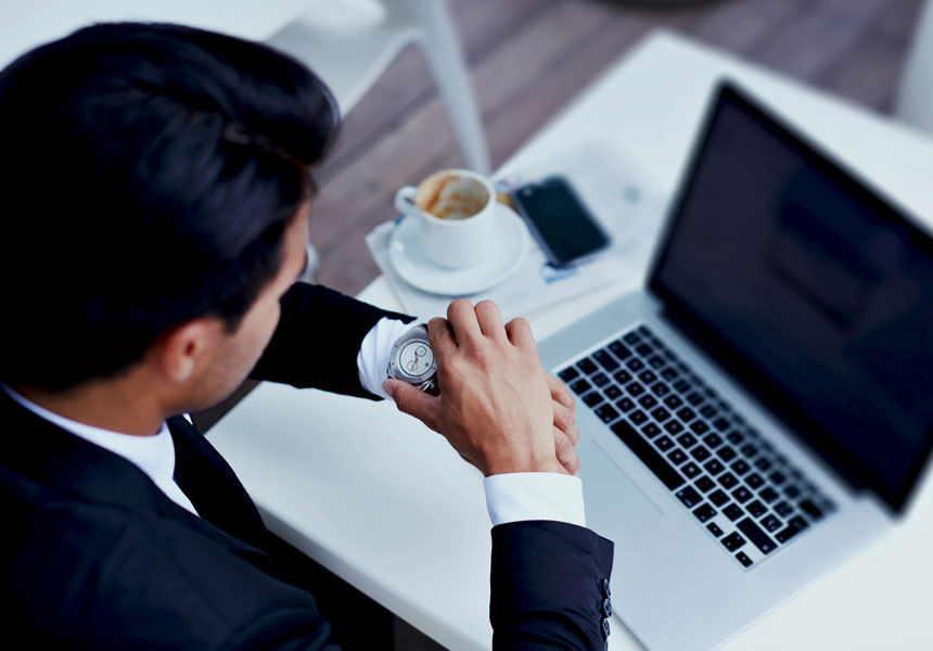 coffee laptop work man looking at watch