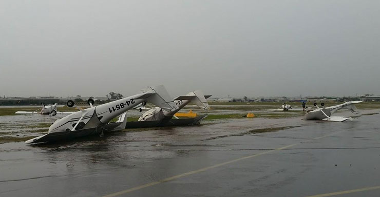 Destructive winds flipped planes at Archerfield airport.
