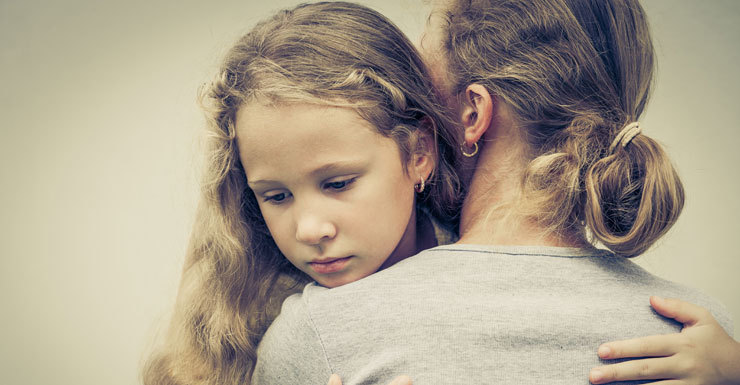 Hug sad child Shutterstock