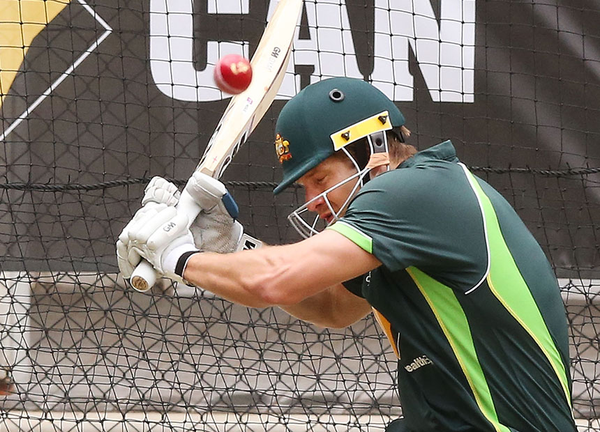 Shane Watson is bounced by one of his teammates in the Adelaide nets.