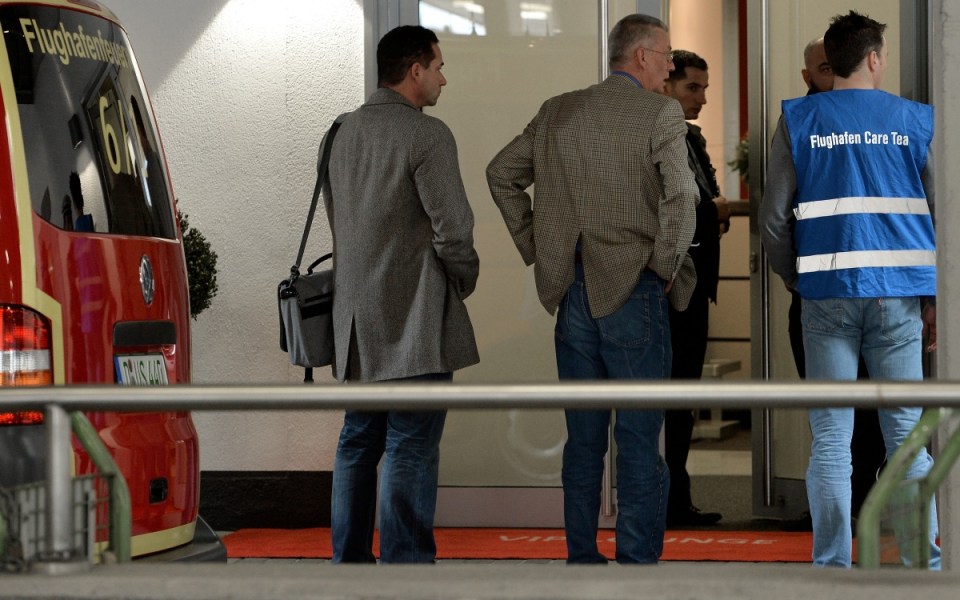 People arrive at a holding area for friends and relatives of passengers on Germanwings