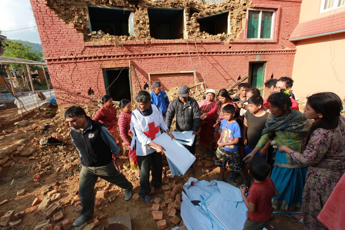 Red Cross distribute tarpaulins to displaced residents in Kathmandu.