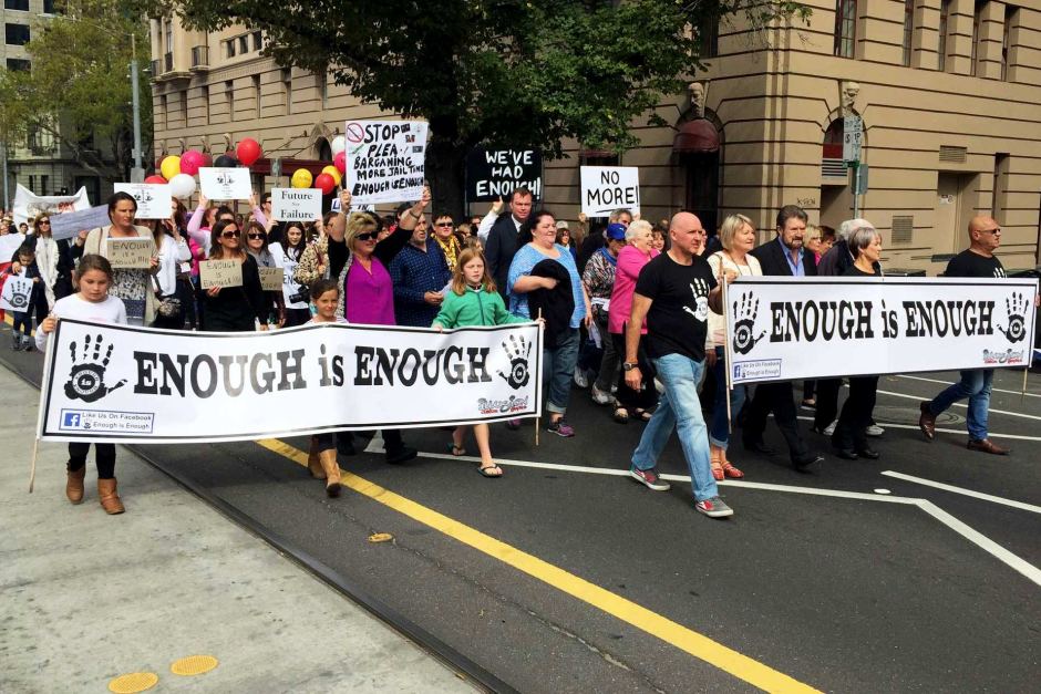 Protesters held a silent march to the steps of Victoria's Parliament House for violence against women.