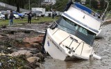 A boat is washed up on the Gosford Waterfront on the Central Coast