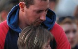 Stephanie Scott's fiance Aaron Leeson-Woolley is consoled by family as he visits the memorial.