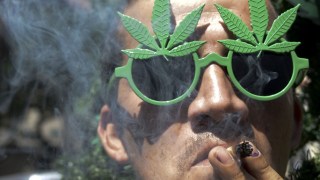 man smokes marijuana. Getty