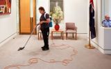 A cleaner vacuuming the Prime Minister's office at Parliament House in Canberra.