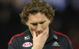 James Hird looks dejected as he leaves the field.
