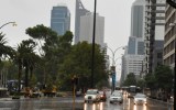 Rain inundates St Georges Terrace in Perth earlier this year.