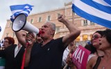 Pro-Euro protesters gather in front of the parliament building in Athens.