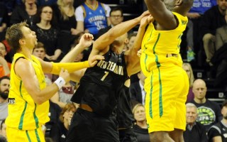 Australia's Nathan Jawai shoots against New Zealand.