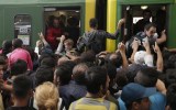 Migrants storm train in Hungary