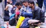Migrants wait at the transit zone of Eastern (Keleti) railway main station in Budapest.