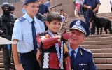 Iron Boy is awarded a medal of valour by NSW Police Commissioner Andrew Scipione.