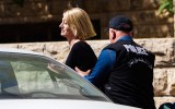 Tara Brown is escorted from a Beirut court on Monday.
