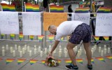 A memorial with 50 candles for at least 50 people gunned down at a gay nightclub in Orlando, Florida.f
