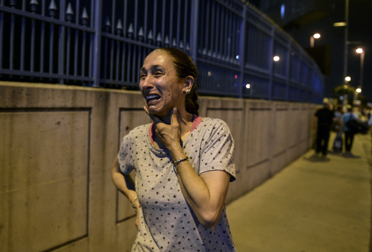 A woman crying outside Ataturk Airport.