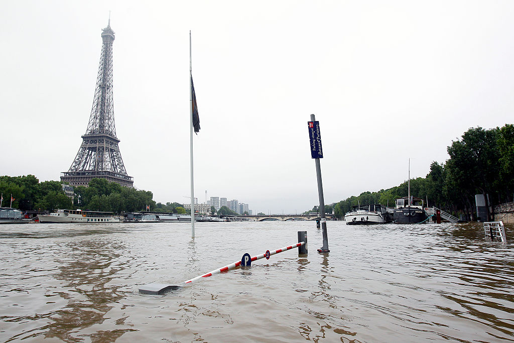 Water rises near the area of the Eiffel Tower alongside the Seine.
