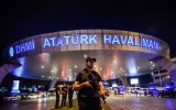 A Turkish riot police officer patrols Ataturk airport in Istanbul.
