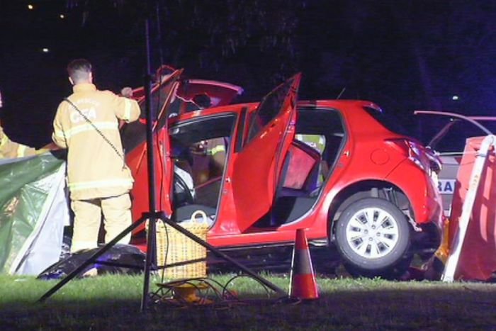 The red hatchback at the scene of the accident.