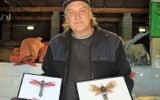 Steve Wakeling with mounted recycled bugs