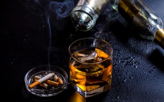 Stock image of cigarettes and alcohol