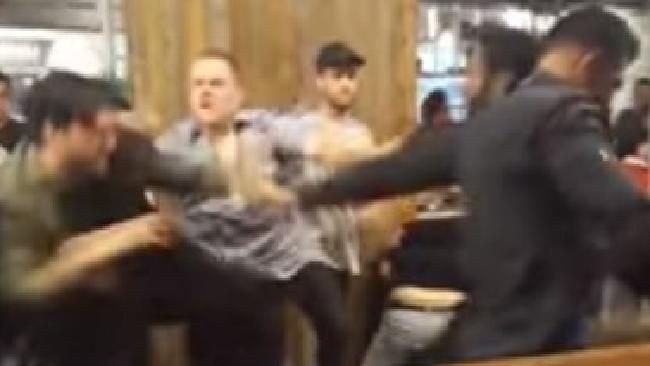 Police are searching for 10 men after a brawl broke out at Melbourne Central on Saturday night.