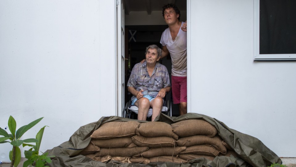 flood warning as ex-cyclone owen dumps heavy rain