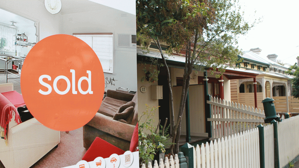 A photo of a sold sign on a house